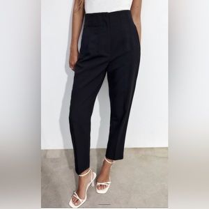 High waisted pants, front zip, metal hook, and inside button closure